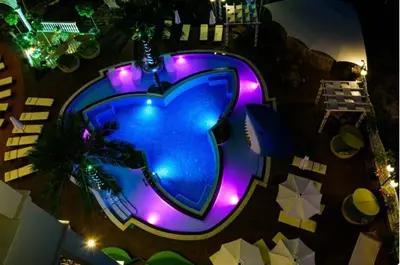 an overhead view of a swimming pool with purple lights at Sweet Homes 6 in Sunny Beach