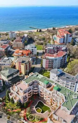 an aerial view of a city with the ocean at Marina Studio in Ravda
