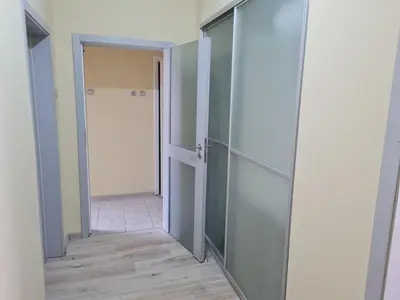 an empty room with an open door and a corridor at Spacious apartment 