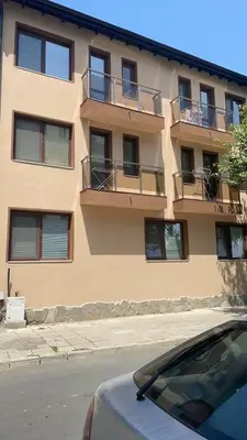 a building with a car parked in front of it at Къща за гости “Недев” in Tsarevo