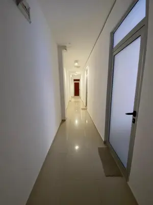 an empty hallway with a large door and a corridorngthngthngthngthngthngth at Studios & Apartments Perla in Sunny Beach