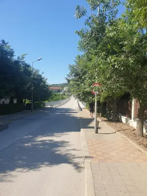 an empty street with trees on the side of the road at Seaside 1-BR Apartment with Pool Access in Byala
