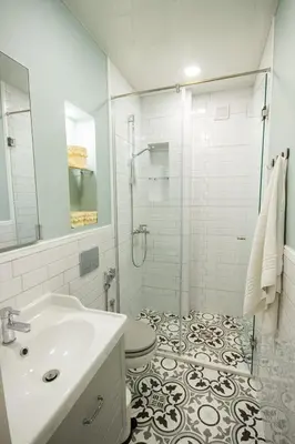 a bathroom with a shower and a toilet and a sink at COZZIE by RV Apartments in Varna City