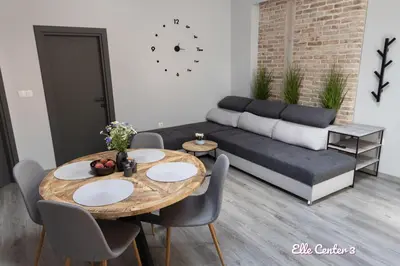 a living room with a couch and a table and chairs at Elle Center by RV Apartments - TOP center in Varna City