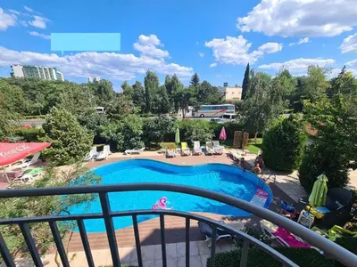 a view of a swimming pool from a balcony at Sunny Gardens in Sunny Beach