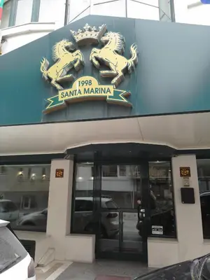 a sign on the side of a building at Санта Марина in Varna City
