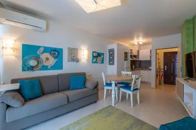 a living room with a couch and a table at Solero in Pomorie