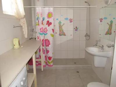a bathroom with a shower and a sink and a toilet at Apartments and studios in Cote d’Azure in Sunny Beach
