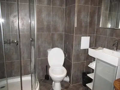a bathroom with a toilet and a shower and a sink at Apartments and studios in Cote d’Azure in Sunny Beach