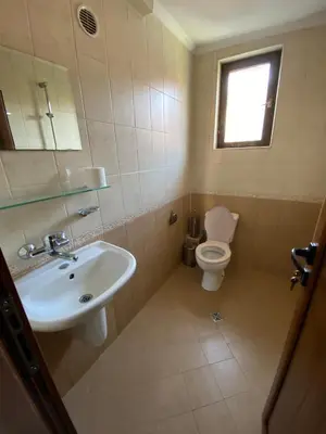 a bathroom with a sink and a toilet at Апартамент 