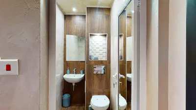 a bathroom with a toilet and a sink at Markoni 4 in Burgas City