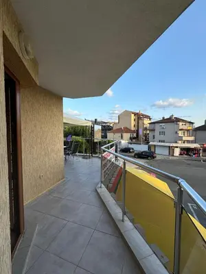 a balcony of a building with a view of a street at Къща за гости Деневи in Primorsko