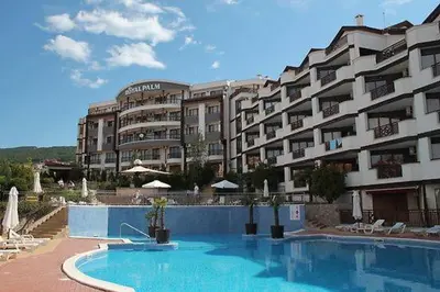 a large apartment building with a large swimming pool at Александър Студио in Sveti Vlas