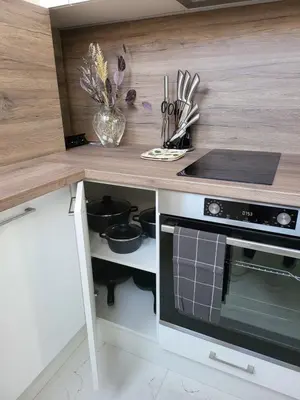 a kitchen with a counter with a stove top oven at AMAYA in Varna City
