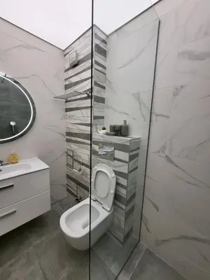 a bathroom with a toilet and a sink and a shower at AMAYA in Varna City