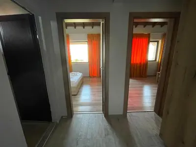 a room with two doors and a bedroom with a bed at Studio 8 Arapya in Tsarevo