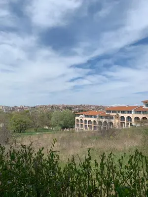 a large building in the middle of a field at Апартамент Silver Star in Sozopol