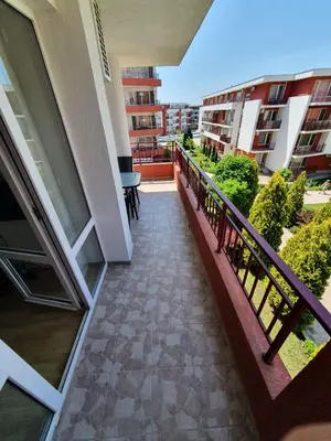 a balcony of a building with a table and chairs at Apartmán TTT in Burgas City