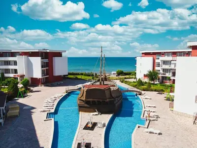 a pool at the resort with a boat in it at Apartmán TTT in Burgas City