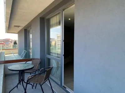 a balcony with a table and two chairs and a table at PARADISO 'B' 605 Private Apartment Nessebar in Nesebar