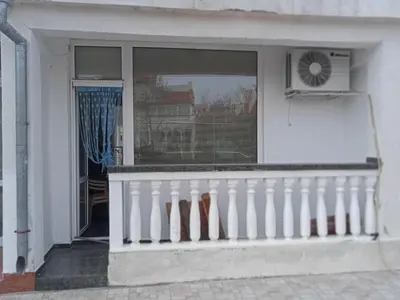 a white porch with a window and a fan at Апартамент Браво in Sunny Beach