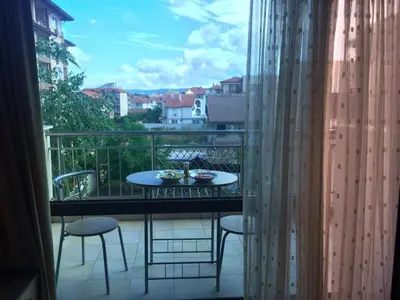 a view of a balcony with a table and chairs at Cozy 1 bed apartment in Lesso Complex (Ravda, Nessebar) in Ravda