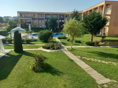 a garden in front of a large building at Sozopoli Hills, app B7 in Sozopol