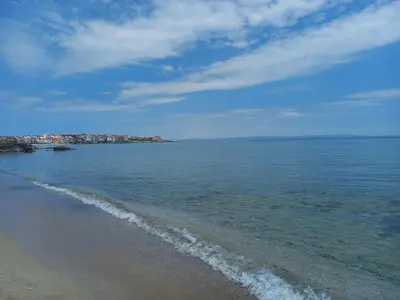 a beach with the ocean and a city in the background at Sozopoli Hills, app B7 in Sozopol