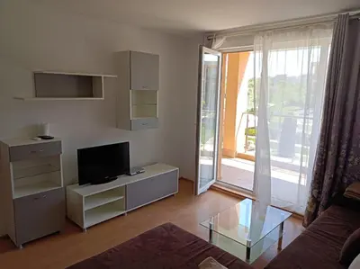 a living room with a couch and a tv at Sozopoli Hills, app B7 in Sozopol
