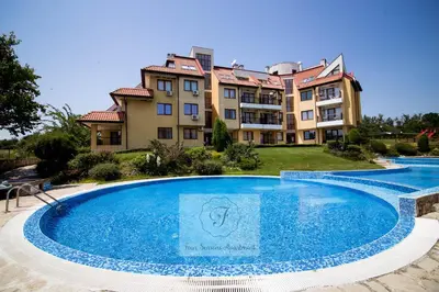 a large swimming pool in front of a building at BohoTide by the Sea in Bliznatsi