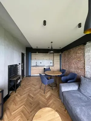 a living room with a couch and a table at Sea Scenery Apartment in Burgas City