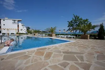 a man is playing in a swimming pool at Vilmar Studio in Pomorie