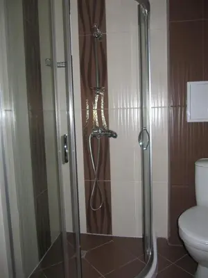 a shower stall in a bathroom with a toilet at Rayski zalez in Pomorie