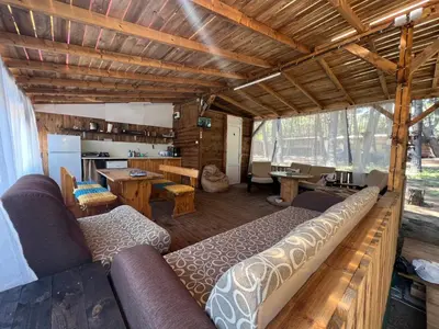 a living room with a couch and a table at Каравана Чайка in Sozopol