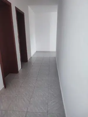 a hallway with two doors and a tile floor at Fa Mol in Sunny Beach