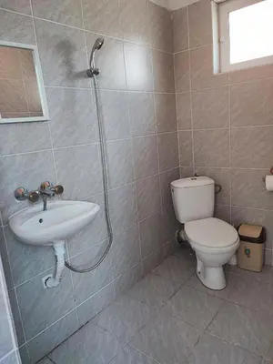 a bathroom with a toilet and a sink and a shower at Fa Mol in Sunny Beach