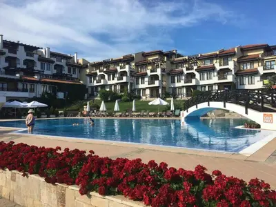 a large swimming pool with a bridge and some buildings at Luxory Apartament on the Seaside, Gradina beach, St Nicholas Complex in Chernomorets
