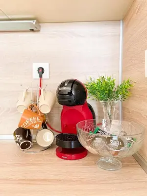 a coffee maker sitting on top of a counter at Blue Sky Apartments in Nesebar