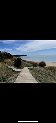 a path leading to a beach with the ocean at Brand new first line Sea view 1 bedroom apartment in Burgas City