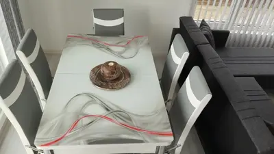 a table with a shell sitting on top of it at Valemar Apartments in Pomorie