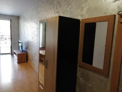 a room with a door to a room with a television at Lovely Studio in a Complex with a Pool by Flat Mаnаger in Sveti Vlas