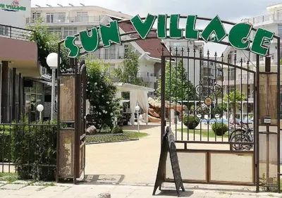 a gate with a sign that reads sun village at Ideal three bed apartment for families closed to the Beach in Sunny Beach