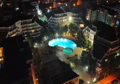 an overhead view of a pool in a city at night at Ideal three bed apartment for families closed to the Beach in Sunny Beach