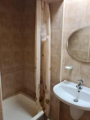 a bathroom with a sink and a toilet and a shower at Къща за гости Катлея in Tsarevo