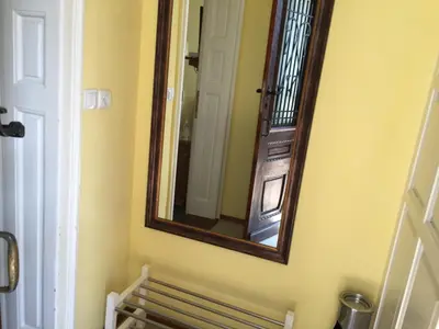 a mirror on the wall of a bathroom at Art Studios Elsor in Burgas City