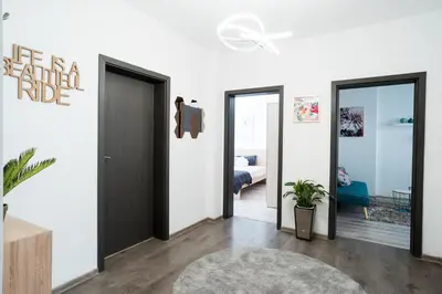 a living room with two doors and a bedroom at Black Sea Top Centre Apartments by Flat manаger in Varna City