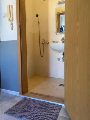 a bathroom with a shower and a sink at Dadi Oazis Ravda in Ravda