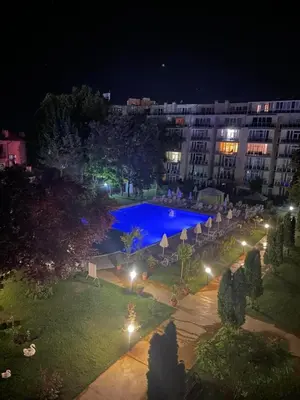 a view of a swimming pool at night at Dadi Oazis Ravda in Ravda
