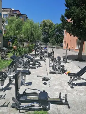 a row of exercise equipment in a parking lot at Dadi Oazis Ravda in Ravda