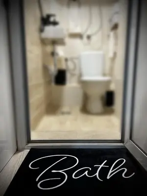 a window of a bathroom with a toilet behind it at A&K Guest Studio in Varna City